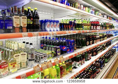 Chernihiv / Ukraine. 06 March 2016:different kinds of beer and soft drinks like cola with wide assortment on the shelves of supermarket. 06 March 2016 in Chernihiv / Ukraine.