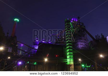 Duisburg, Germany - May 18, 2015: Nocturnal shot of Landschaftspark Nord illuminated industrial plant in Duisburg Germany. Landschaftspark is a public park located in Duisburg-Meiderich, Germany.