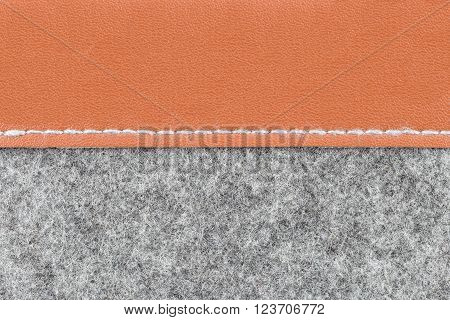Background of close up on gray fabric texture and brown leather;