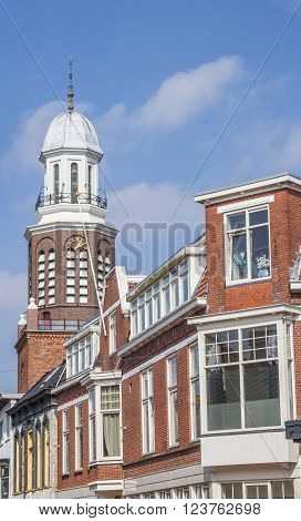 Houses and church tower in the center of Winschoten Holland