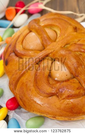 portuguese traditional Easter cake Folar on brown wooden background