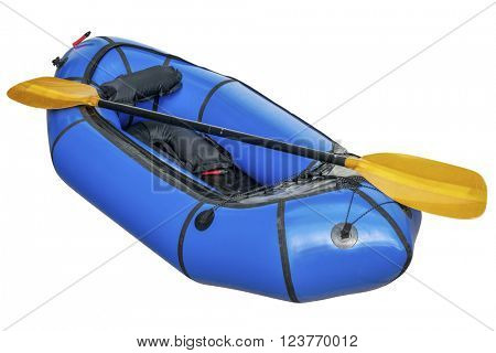 a blue packraft (one-person light raft used for expedition or adventure racing) with a paddle isolated on white with a clipping path
