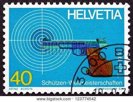 SWITZERLAND - CIRCA 1974: a stamp printed in the Switzerland shows Target and Pistol World Marksmanship Championships Thun and Bern circa 1974