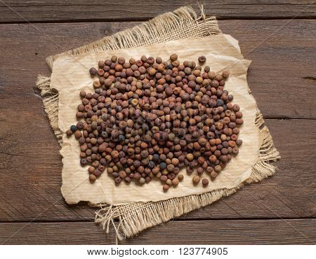 Raw organic roveja beans on a wooden table