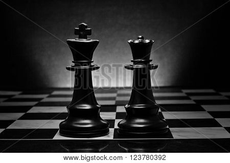 Chess. Black King and Queen on the board .The most powerful figures. Set of chess figures.