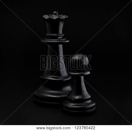 Chess. Black Pawn and Queen on black background.