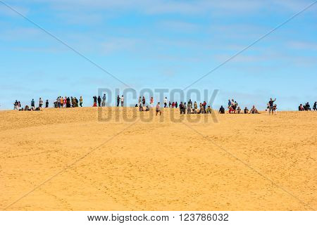 People Visiting The Highest Sand Dune Of Pyla In Europe