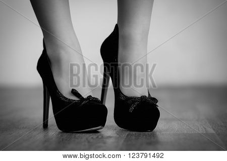 Autumn fashion outfit. Fashionable woman long legs in tights black stylish high heels shoes with rhinestones