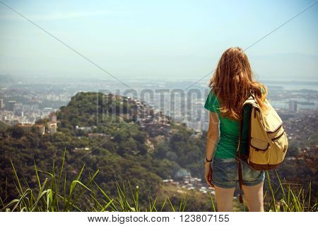girl tourist with a backpack on the background Rio de Janeiro