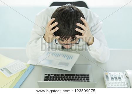The businessman who is at the wits end, and grieves