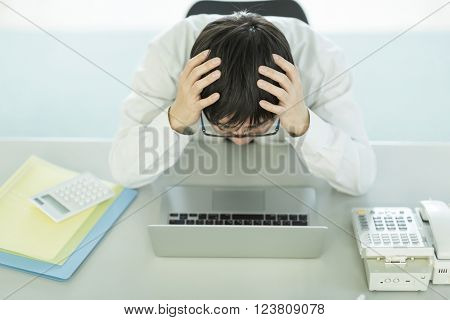 The businessman who is at the wits end, and grieves