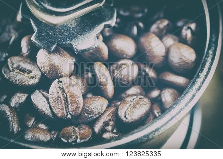 Closeup Of Coffee Beans With Focus Coffee Beans On Coffee Grinder,vintage Toning