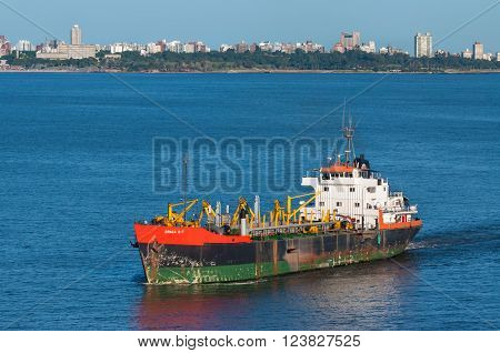Montevideo Uruguay - December 15 2012: Trailing Suction Hopper Dredger Draga D-7 in the Port of Montevideo Uruguay. Montevideo has a natural port with the enough dredging to allow cargo ships dock comfortably.