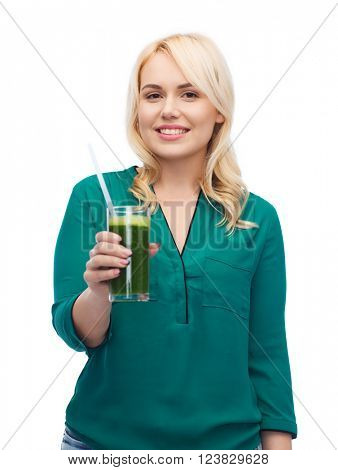 healthy eating, vegetarian food, diet, detox and people concept - smiling young woman drinking green vegetable juice or smoothie from glass
