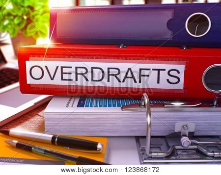Red Office Folder with Inscription Overdrafts on Office Desktop with Office Supplies and Modern Laptop. Overdrafts Business Concept on Blurred Background. Overdrafts - Toned Image. 3D.