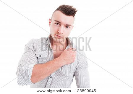 Yound and handsome man touching the shirt collar posing on white background