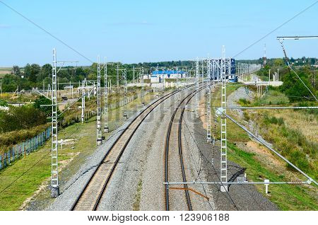 The view from the pedestrian bridge near the station Bogolubovo on railway tracks and the bridge over the River Nerl