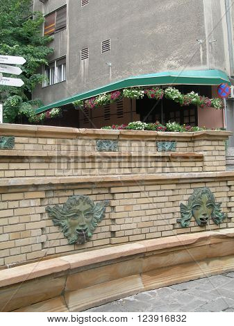 public water fountain for drinking or bathing in historic tourist bohemian quarter of Skadarlija Belgrade Serbia Europe