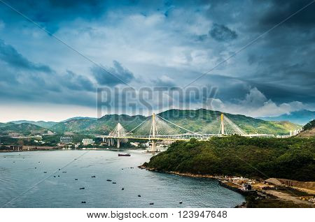 Picturesque landscape with a view on Tsing Ma Bridge, Hong Kong, China. A view with urban and industrial merging with natural mountaings on islands and gorgeous clouds.
** Note: Visible grain at 100%, best at smaller sizes