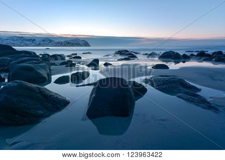 Vikten Beach in the Lofoten Islands Norway in the winter at sunset.