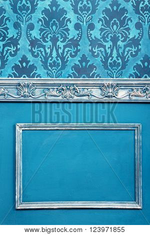 Blue vintage wall with rococo pattern and vintage toning