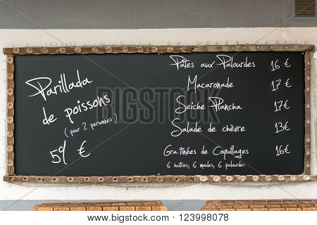 Restaurant menu in oyster producing village Bouziges on French coast