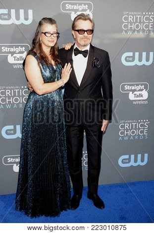 Gisele Schmidt and Gary Oldman at the 23rd Annual Critics' Choice Awards held at the Barker Hangar in Santa Monica, USA on January 11, 2018.