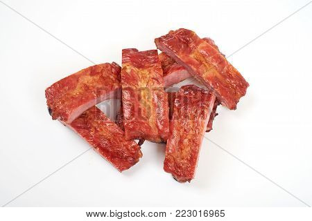 Roasted pork ribs isolated on white background.