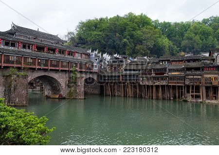 Hong Bridge in Fenghuang Ancient town, Hunan province, China. This ancient town was added to the UNESCO World Heritage Tentative List in the Cultural category.