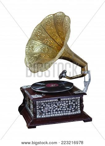 gramophone, ancient record player with a yellow pipe and the box decorated with stones