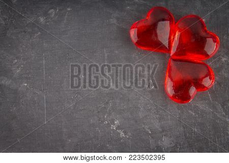 Red hearts on a gray background. The symbol of the day of lovers. Valentine's Day. Concept February 14