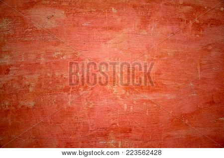 Textured red wall of a village house