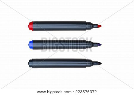 three felt-tip pens, on white background, close-up, black, blue, red