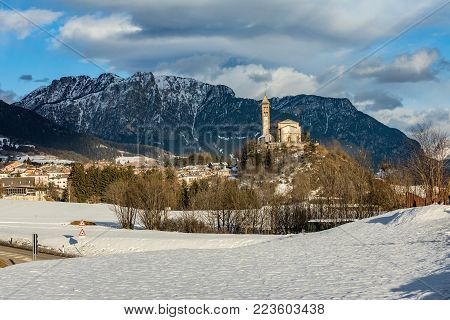 Chiesa di San Giorgio, Castello-Molina di Fiemme in winter time, Italy.