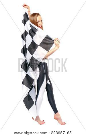 Woman is holding a waving race checkerd flag.
