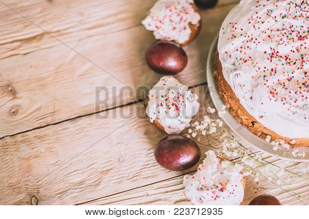 Easter Table With Traditional Easter Cakes And Easter Eggs With Blossoming Tree Branch