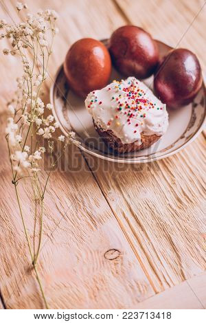 Easter Table With Traditional Easter Cakes And Easter Eggs With Blossoming Tree Branch