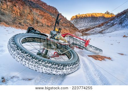 fat bike on a winter trail covered by snow at Colorado foothills