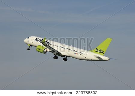 Amsterdam, the Netherlands  -  June 2nd, 2017: YL-CSB Air Baltic Bombardier BD-500 taking off from Polderbaan Runway Amsterdam Airport Schiphol