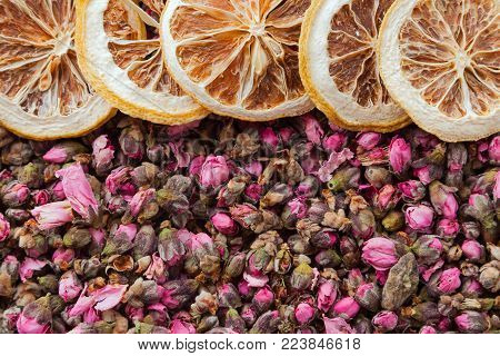 Tea flowers texture. Peach blossom tea with lemon. Organic dried flower tea leaves