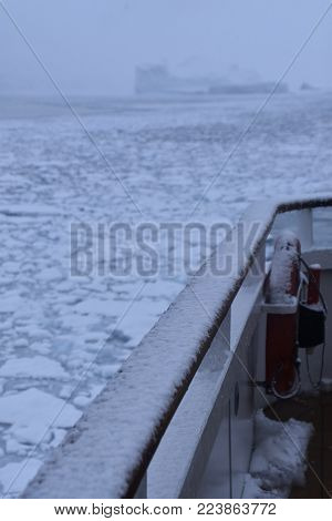 cruise ship navigating on icy waters in winter