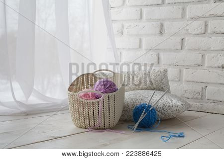 Home Organizers Colored Baskets With Handmade Accessories On Whote Table