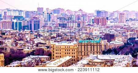 The big city in the fog is a top view. Baku city.