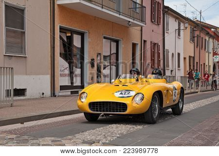 GATTEO, FC, ITALY - MAY 19: driver and co-driver on a racing car Ferrari 500 TR Spider Scaglietti (1956) in historical classic car race Mille Miglia, on May 19, 2017 in Gatteo, FC, Italy