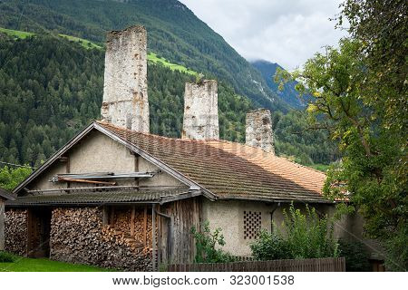 Remains Of The Old Aqueduct In Laas (south Tyrol, Italy) On A Cloudy Day In Summer
