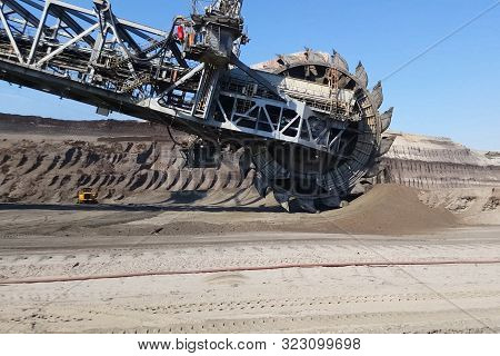 The Work Of A Bucket Wheel Excavator In A Quarry. Ore Mining In A Quarry.