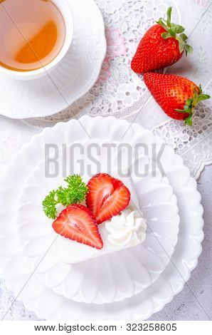 Homemade Cake, Strawberry Shortcake On White Plate With Tea And Decorated With Strawberries Giving T