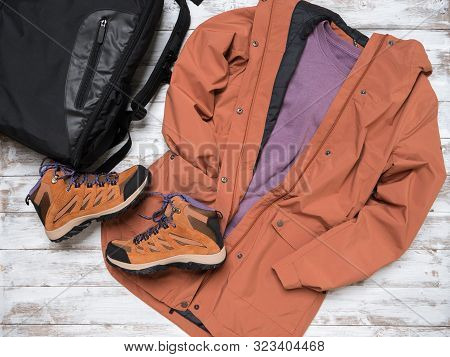 Womens Outwear, Footwear (brown Trench Jacket, Shuede Hiking Boots), Backpack.  Outfit For Traveling