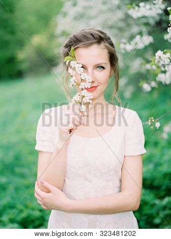 Spring Portrait Of A Young Woman With Blue Eyes