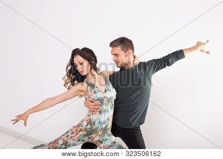 Young Love Couple Dancing Social Danse Kizomba Or Bachata Over White Background With Copy Space